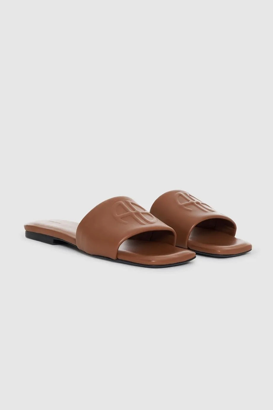 Ria Leather Monogram Embossed Sandals Slides in Brown