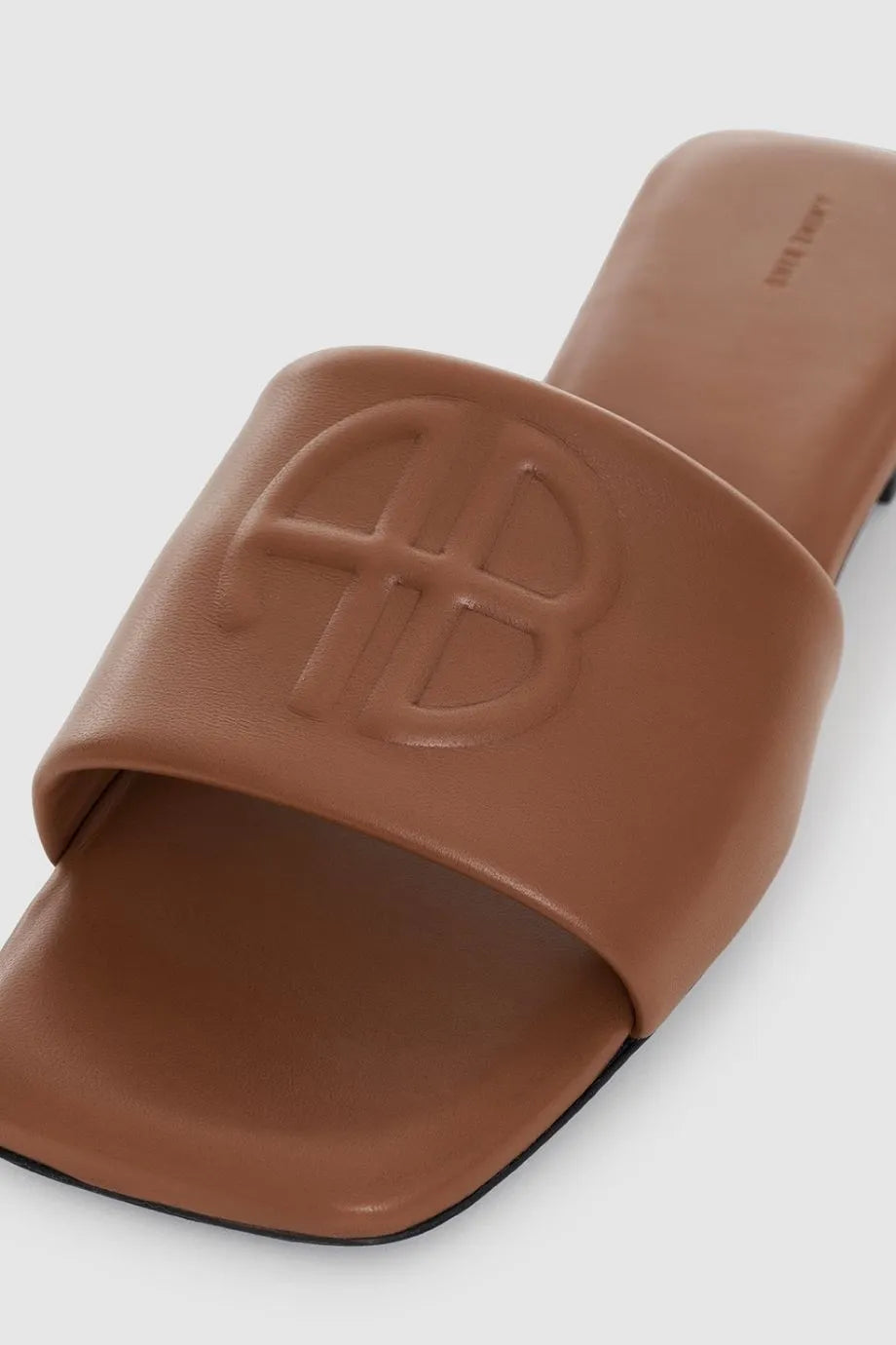 Ria Leather Monogram Embossed Sandals Slides in Brown