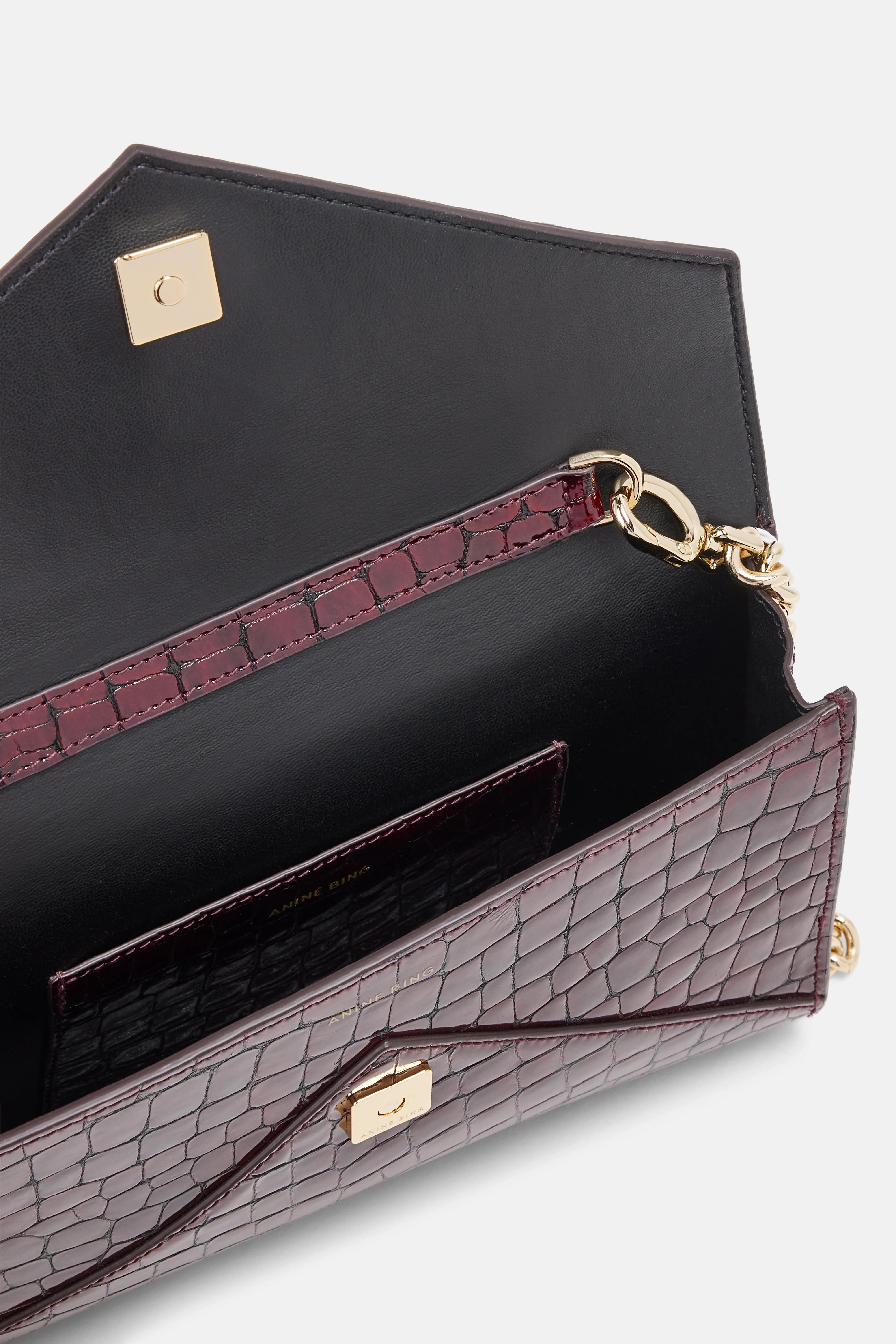 Shop The Elly Logo Embossed Mini Clutch Bag In Burgundy shop-the-elly-logo-embossed-mini-clutch-bag-in-burgundy