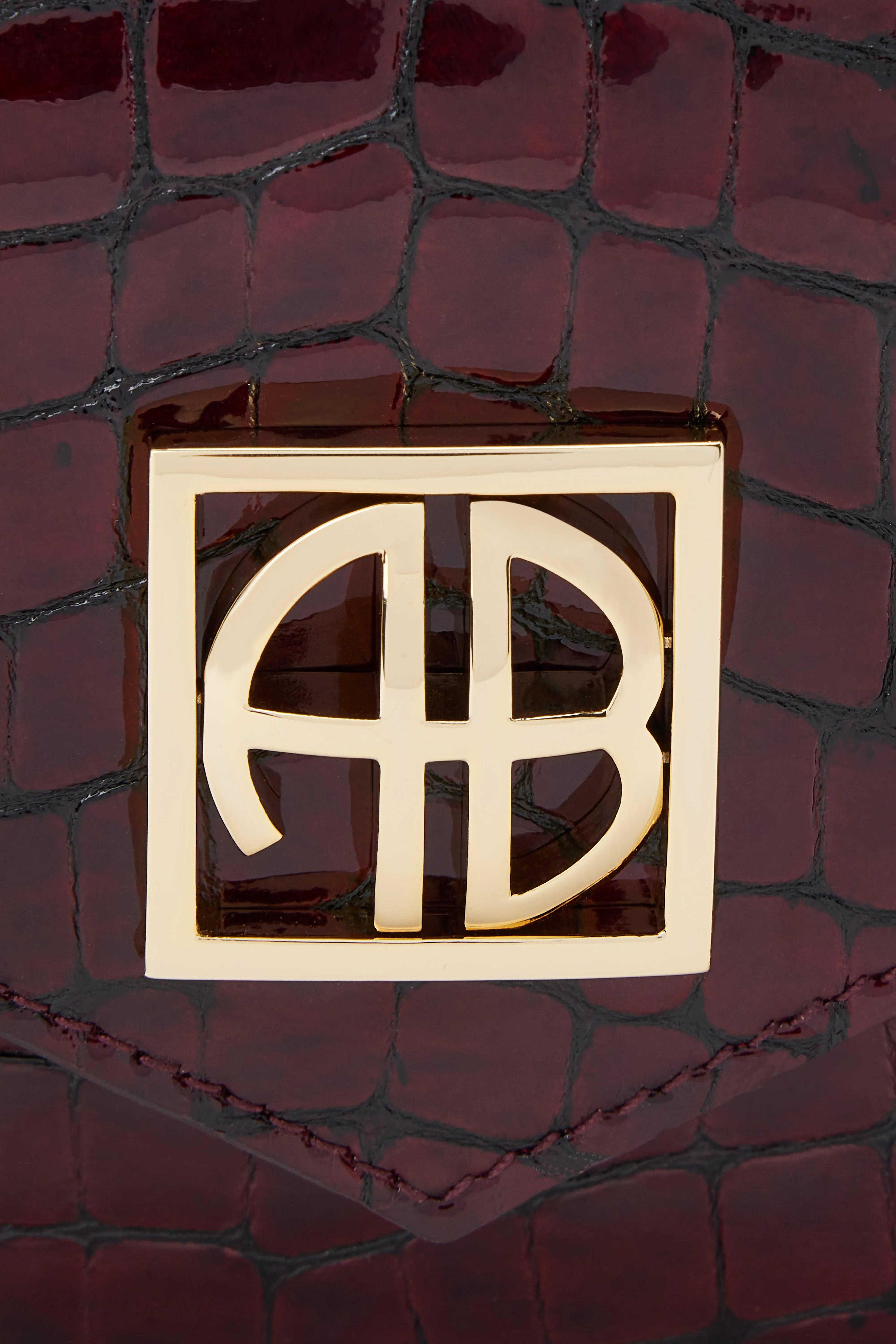 Elly Logo Embossed Mini Clutch Bag in Burgundy