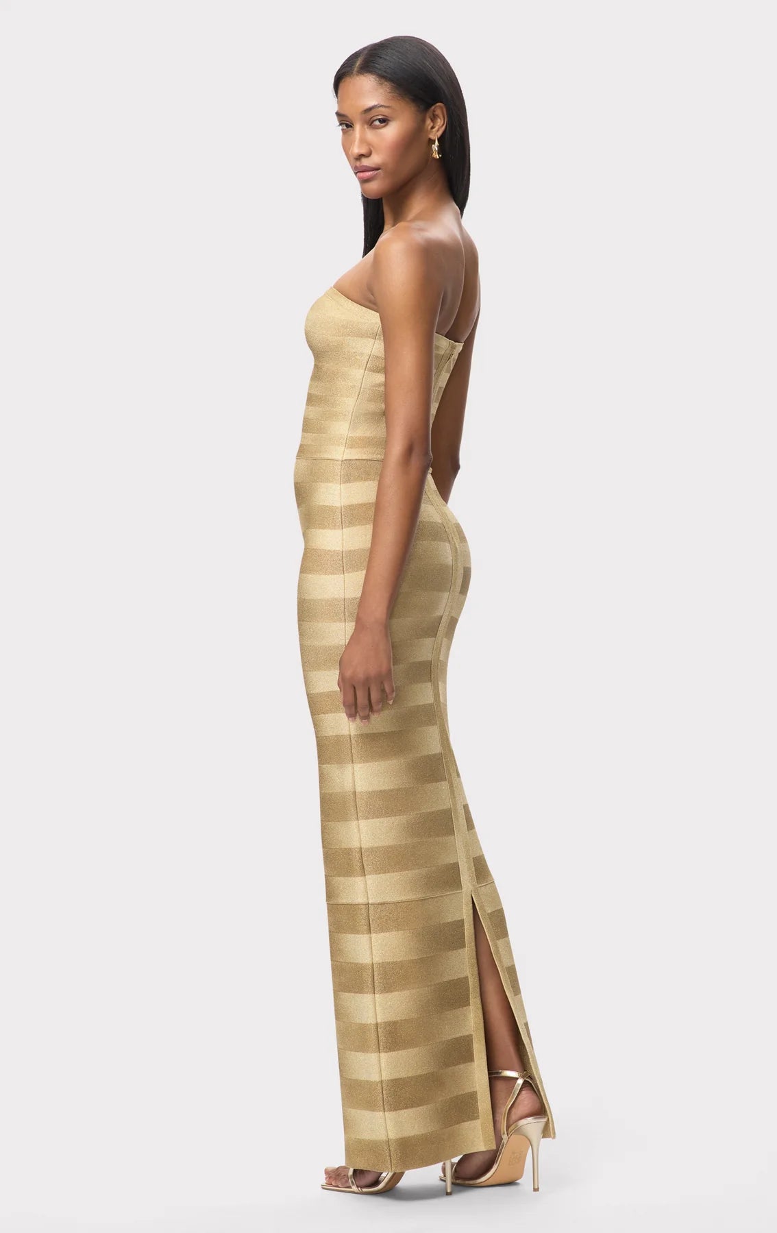 Shop the Nia Bandage Knit Maxi Dress in Gold Shop the Nia Bandage Knit Maxi Dress in Gold